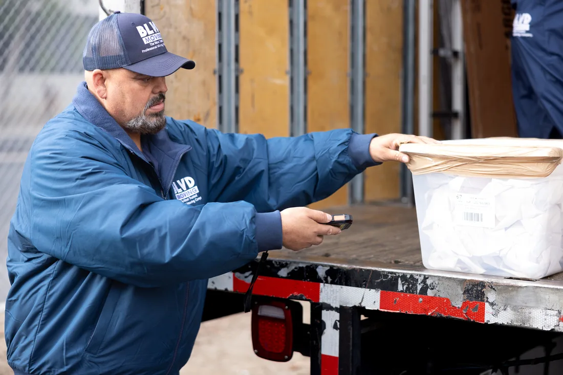 BLVD mover handling a protected furniture item