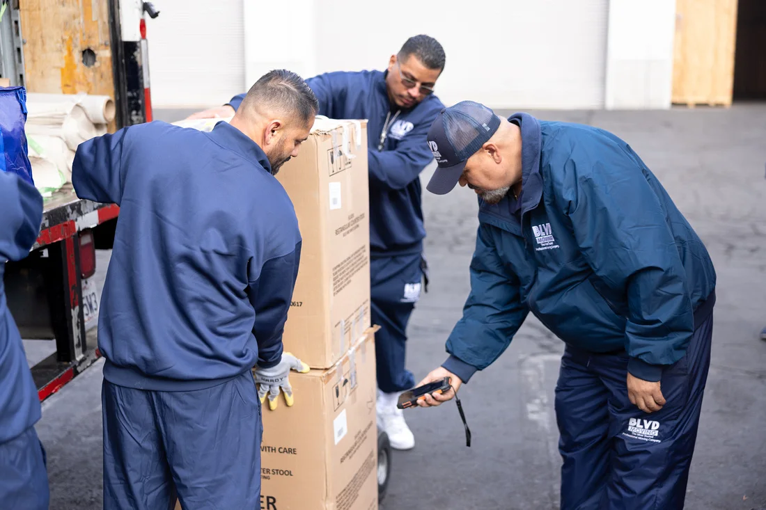 BLVD mover scanning organized cartons during inventory work