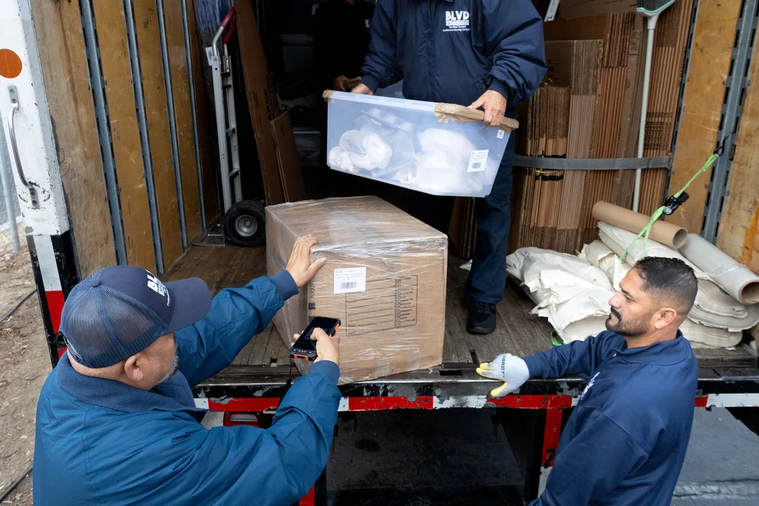 BLVD movers loading boxes